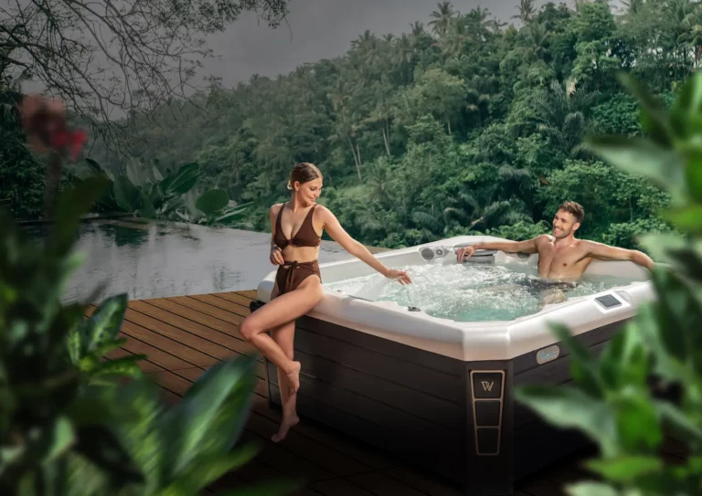 Picture of two people enjoying a Wellis hot tub after searching a hot tub dealer near me in Miami, Florida.
